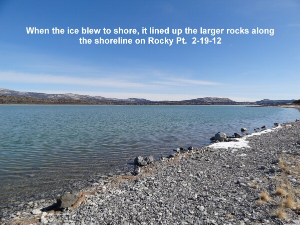 Line-of-rocks-along-the-shoreline-from-ice-blowing-to-shore-2-19-12